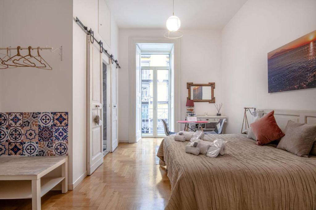 Postel nebo postele na pokoji v ubytování Museum Luxury Suites