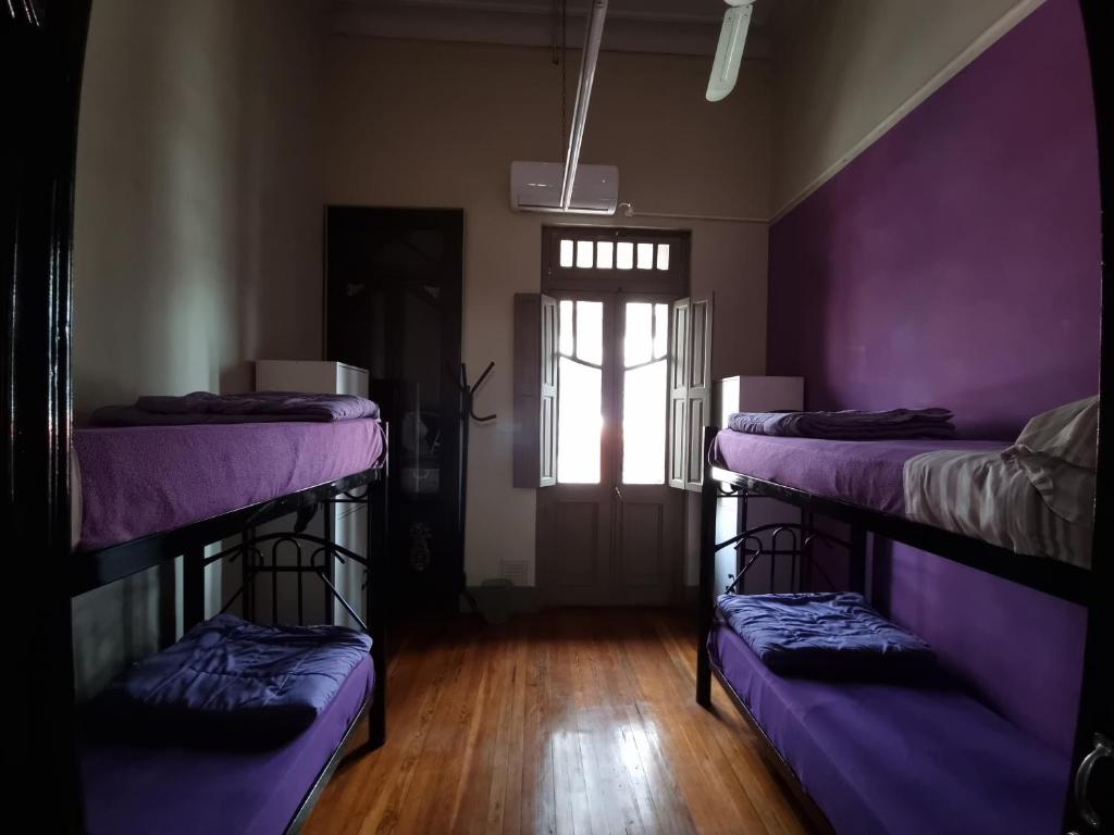 Postel nebo postele na pokoji v ubytování Windmill Hostel