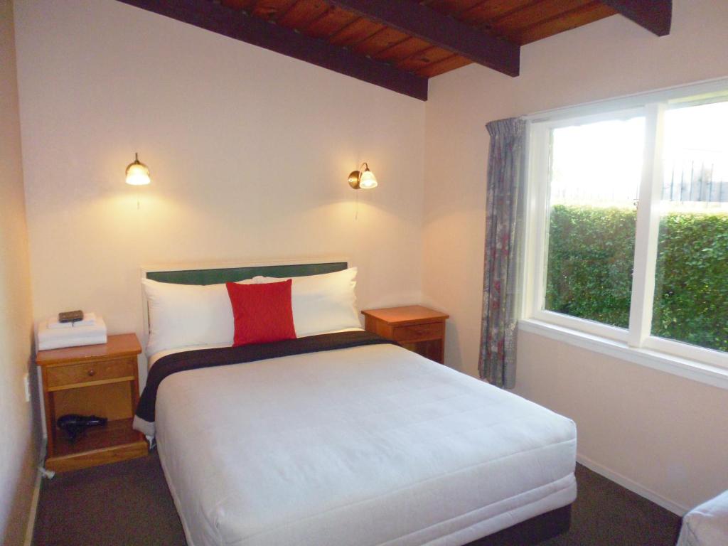 Postel nebo postele na pokoji v ubytování Spa Lodge Motel