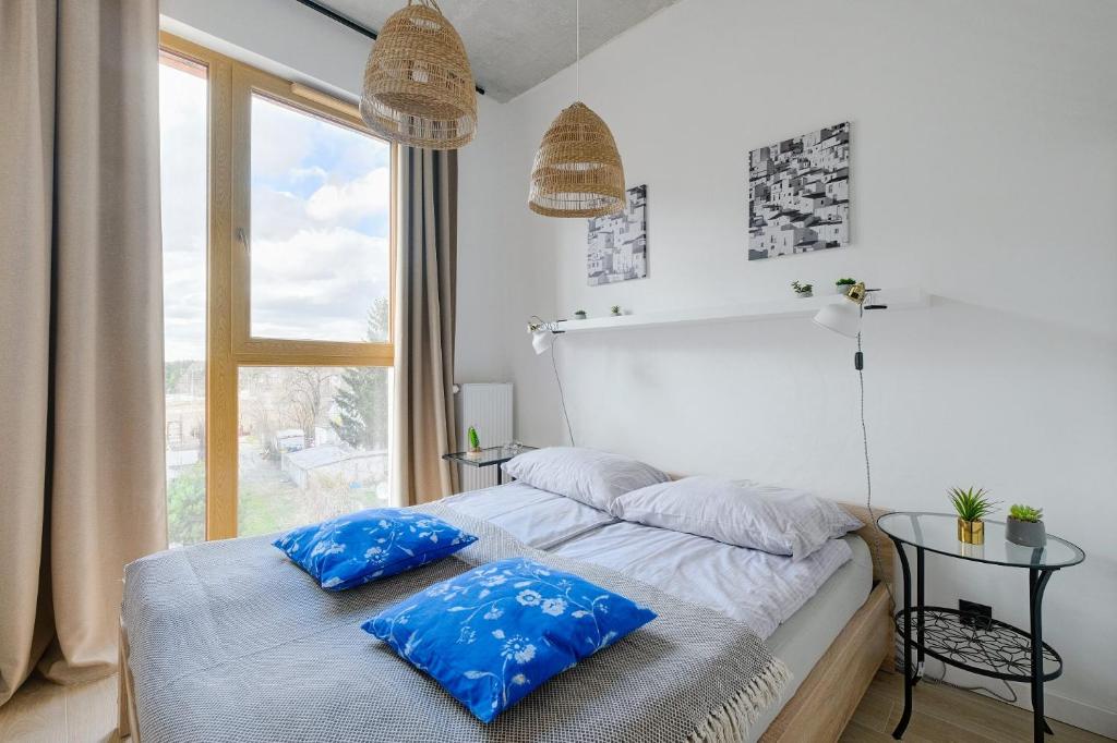 Posteľ alebo postele v izbe v ubytovaní Apartamenty Patriotów 303