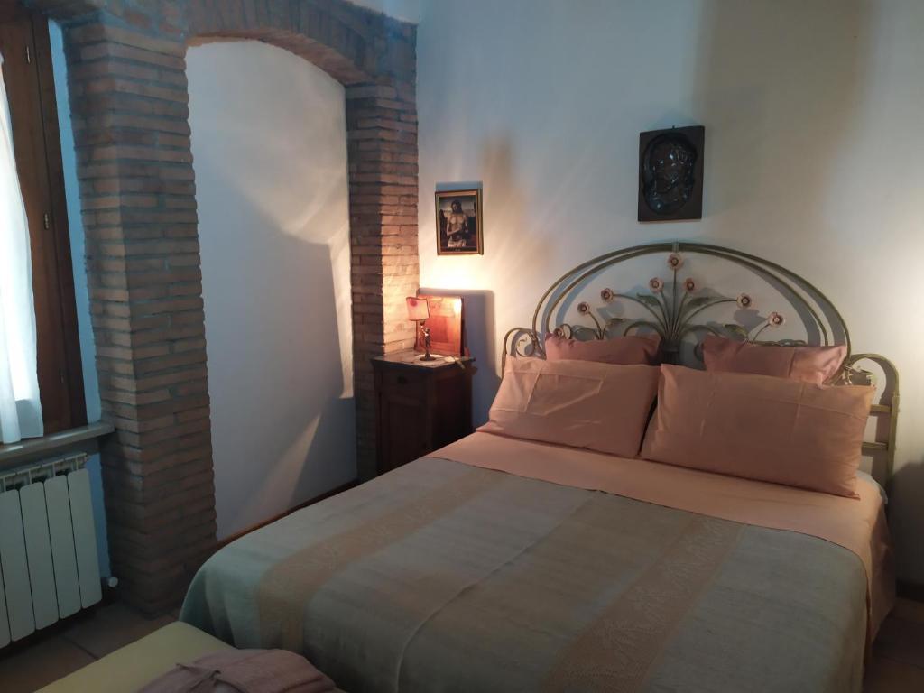 Łóżko lub łóżka w pokoju w obiekcie Centro Storico Perugia - Vista Su Assisi