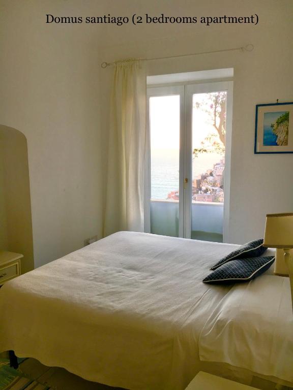 Postel nebo postele na pokoji v ubytování Santiago vacation home in Positano