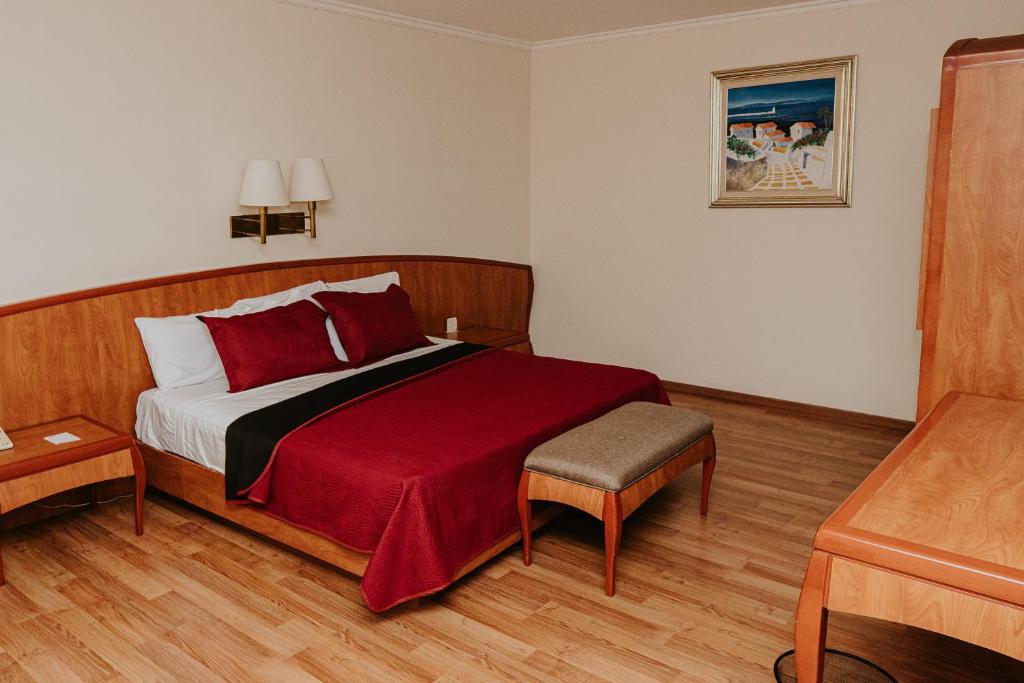 Postel nebo postele na pokoji v ubytování Gran Hotel Diligencias