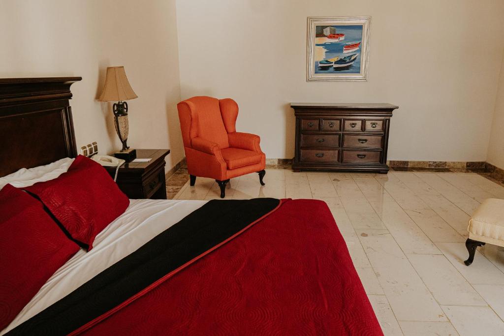 Postel nebo postele na pokoji v ubytování Gran Hotel Diligencias
