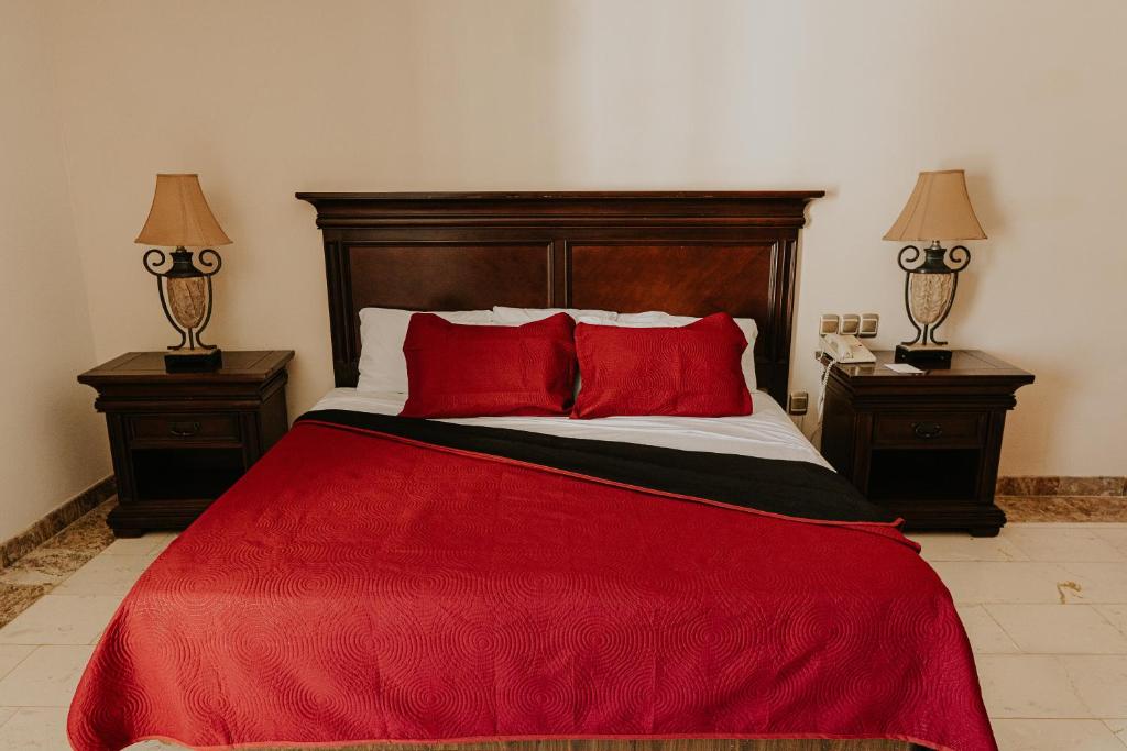 Postel nebo postele na pokoji v ubytování Gran Hotel Diligencias