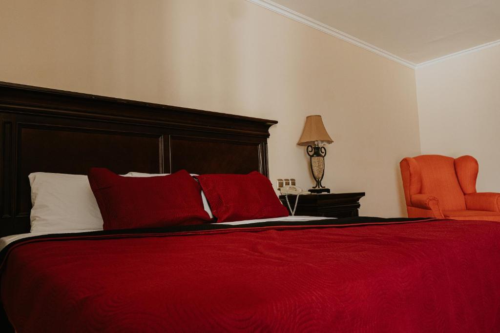 Postel nebo postele na pokoji v ubytování Gran Hotel Diligencias