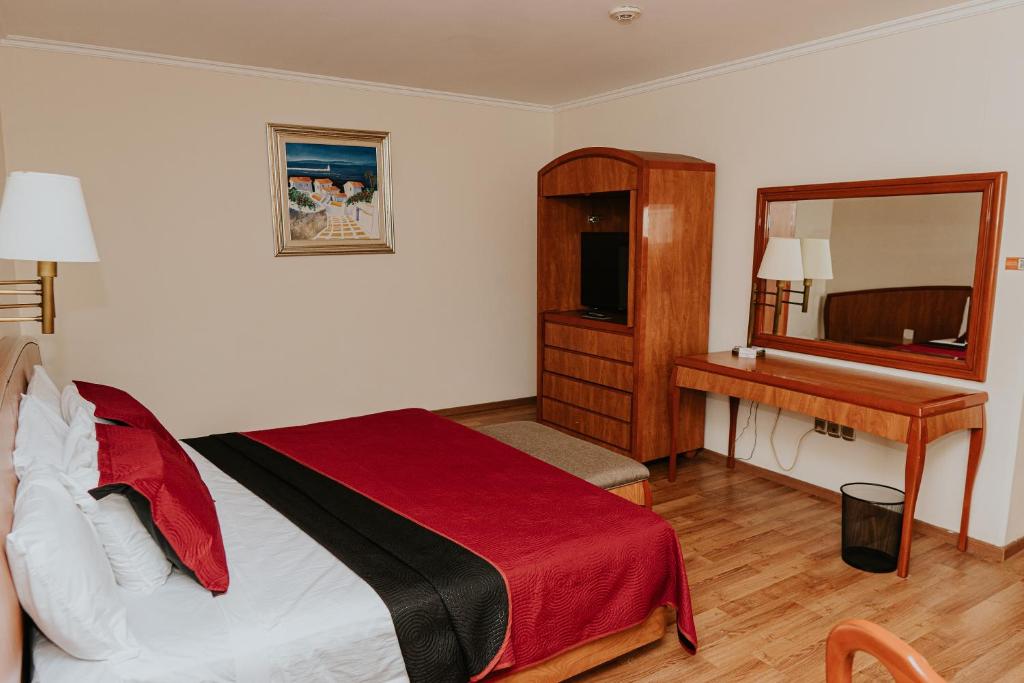 Postel nebo postele na pokoji v ubytování Gran Hotel Diligencias