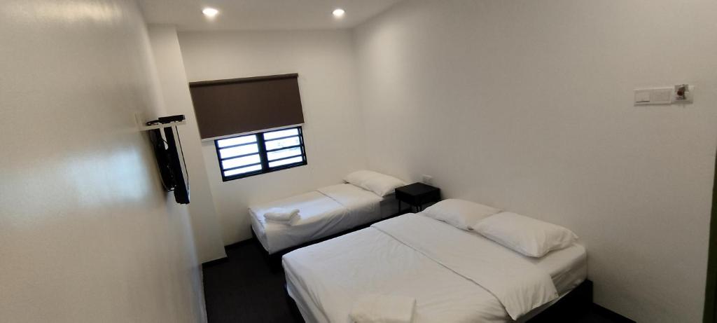 Postel nebo postele na pokoji v ubytování Olive Bedz Hotel