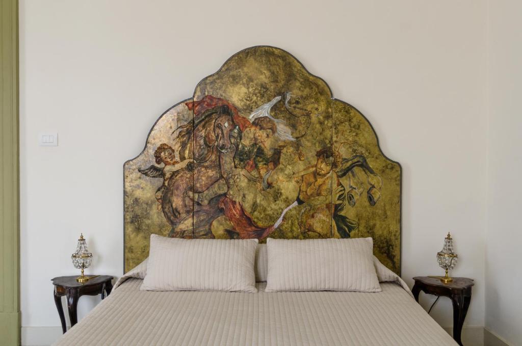 A bed or beds in a room at Don Giovanni Charme Apartment