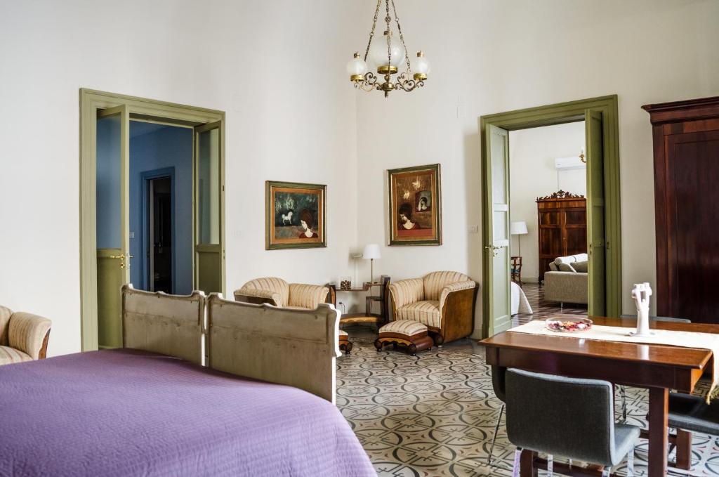 A bed or beds in a room at Don Giovanni Charme Apartment