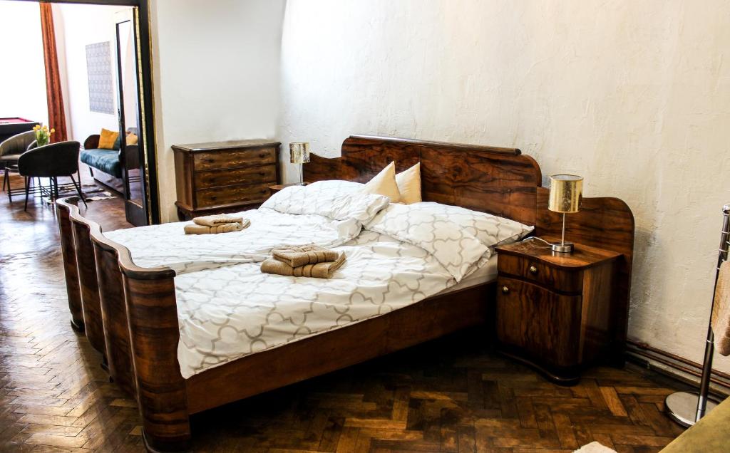 a bedroom with a large bed with two pillows on it at Roth´s Apartment in Košice