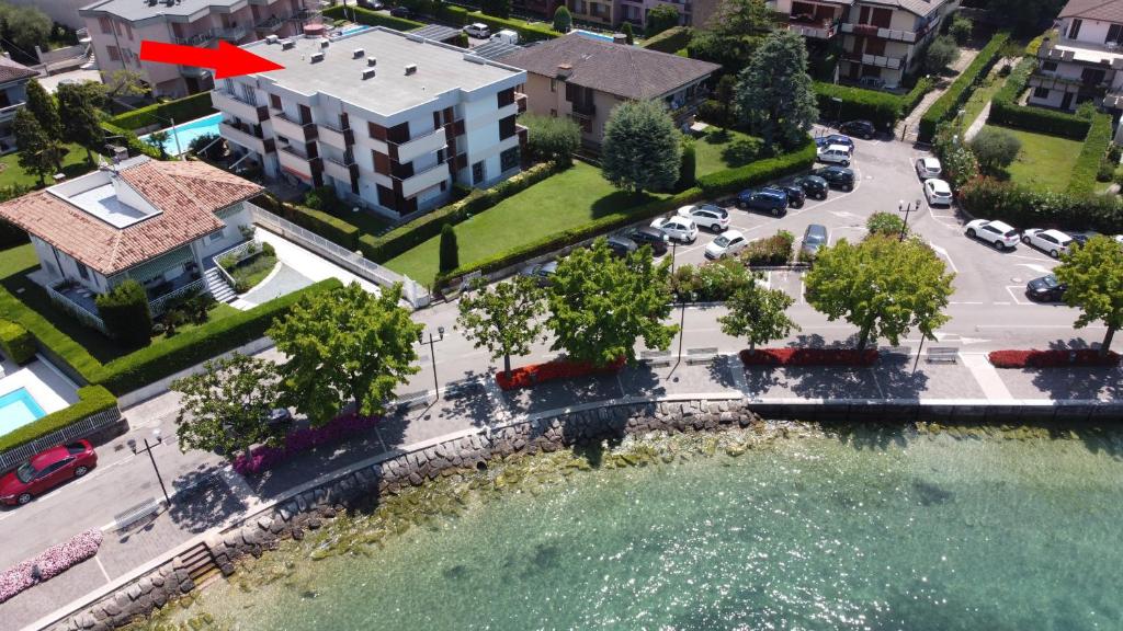 an aerial view of a building and a river at Apartment Bardolino lake front in Bardolino