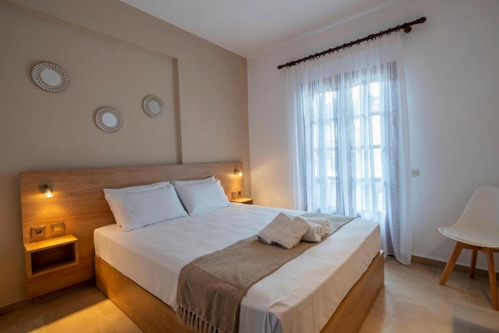 Postel nebo postele na pokoji v ubytování Seaview Studios Kriopigi