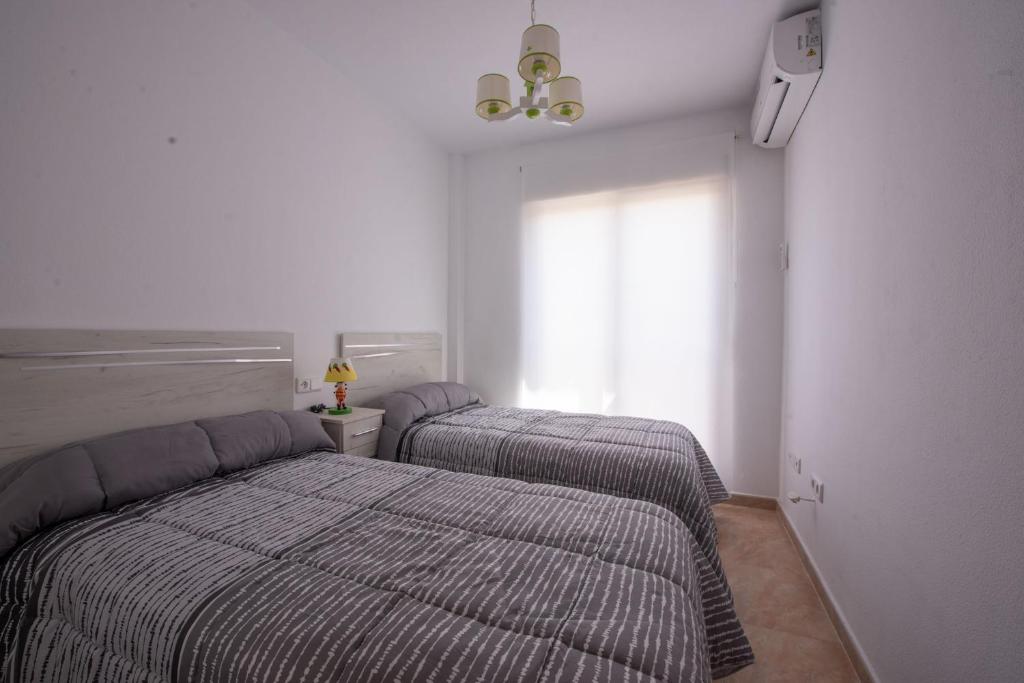 A bed or beds in a room at Holiday beach Gran Alacant
