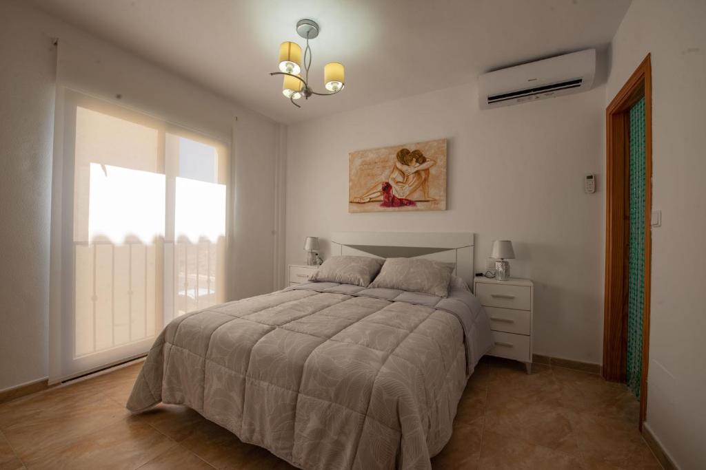 A bed or beds in a room at Holiday beach Gran Alacant