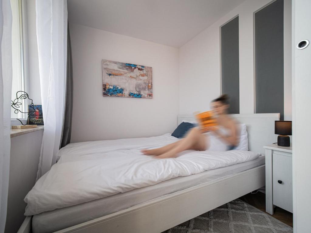 Postel nebo postele na pokoji v ubytování Coco Apartments Kołobrzeska 42