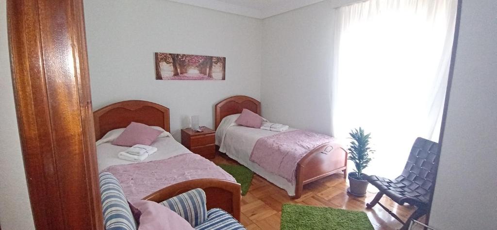 Postel nebo postele na pokoji v ubytování Itzurun, Zumaia, te encantara!