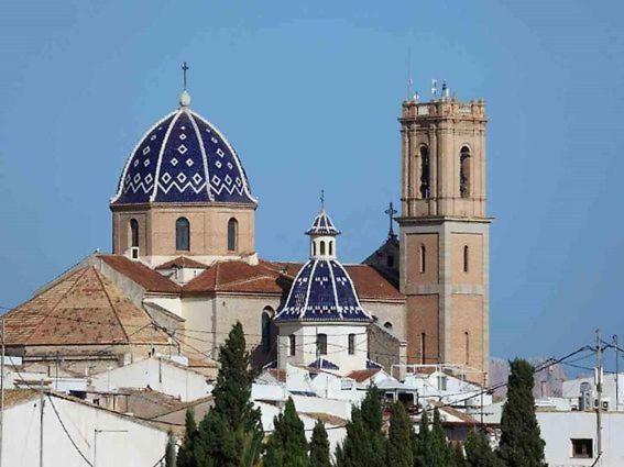 a large building with two towers and a church at FH CAMP PRECIÓS I in Altea