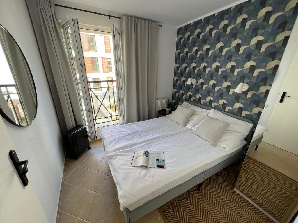 Postel nebo postele na pokoji v ubytování Apartament Przy Plaży PROMENADA Świnoujście