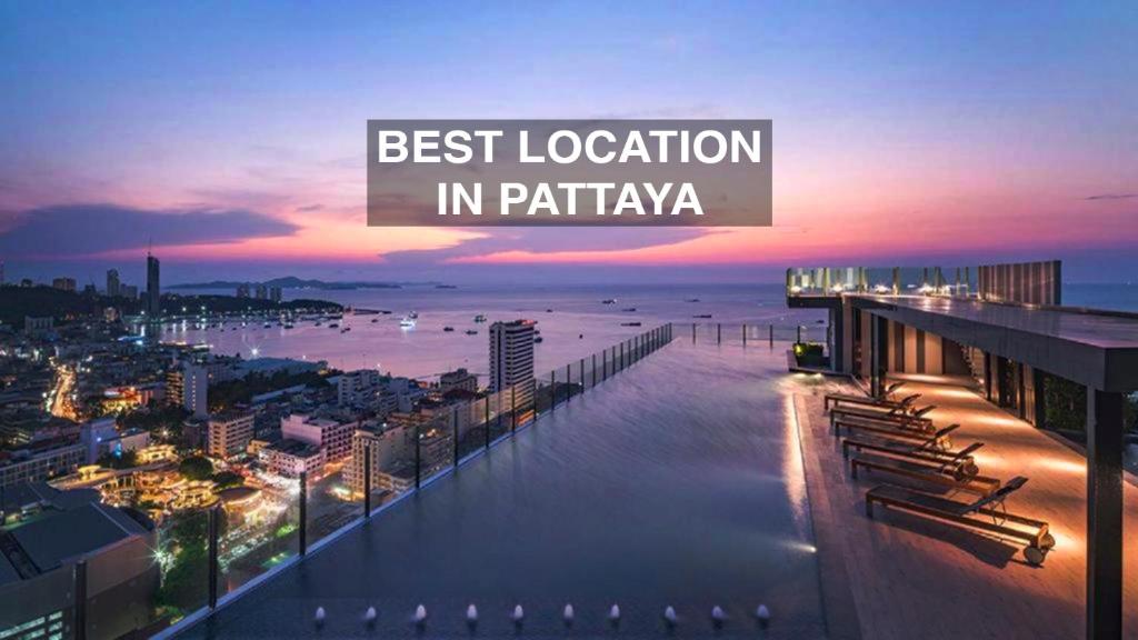 a view of a city at night with the words best location in patania at The Base Central Pattaya apartments in Pattaya Central