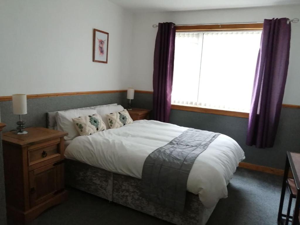 Postel nebo postele na pokoji v ubytování Don Muir Guesthouse