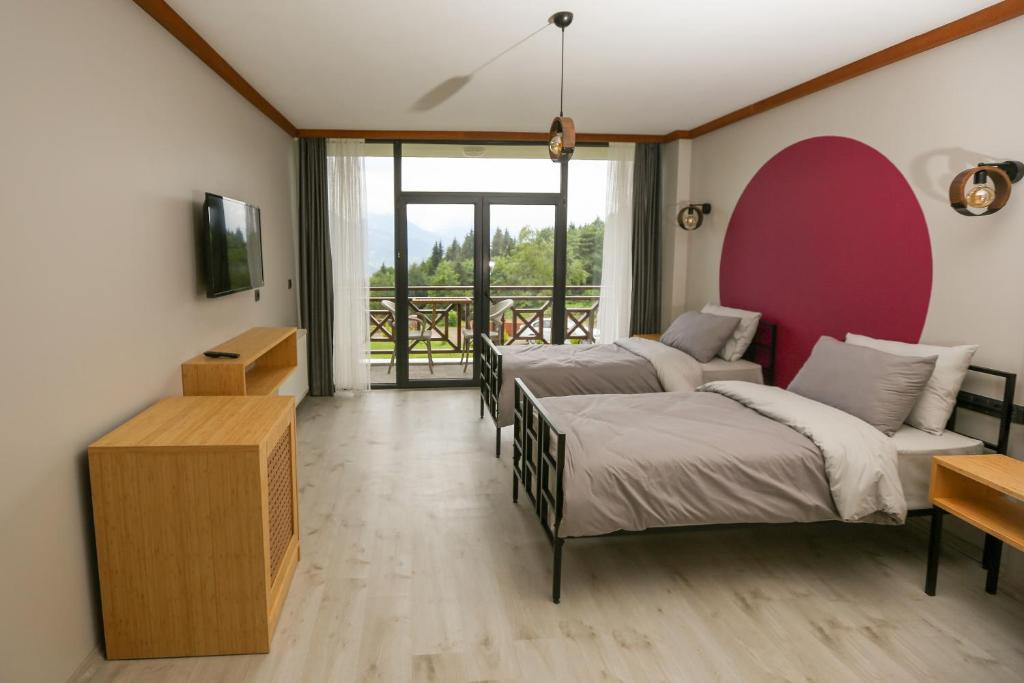 A bed or beds in a room at İspendam Tess Otel