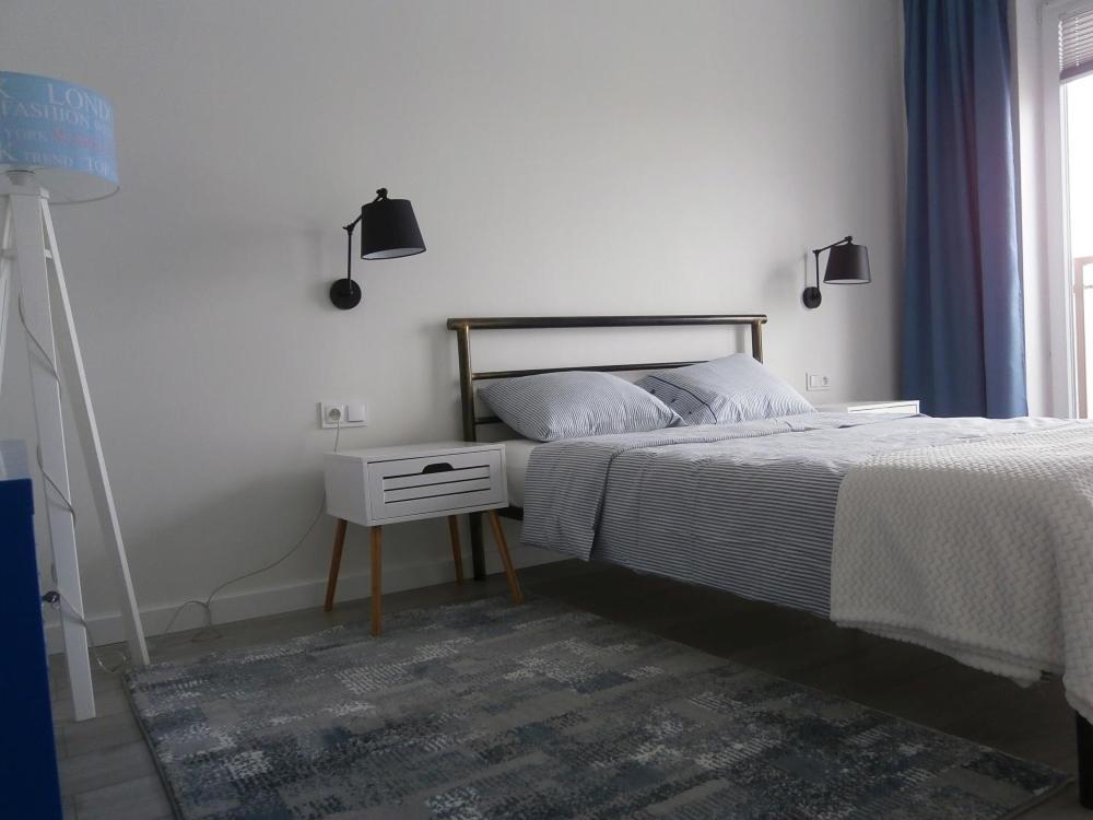 Posteľ alebo postele v izbe v ubytovaní Apartament Dziewiątka