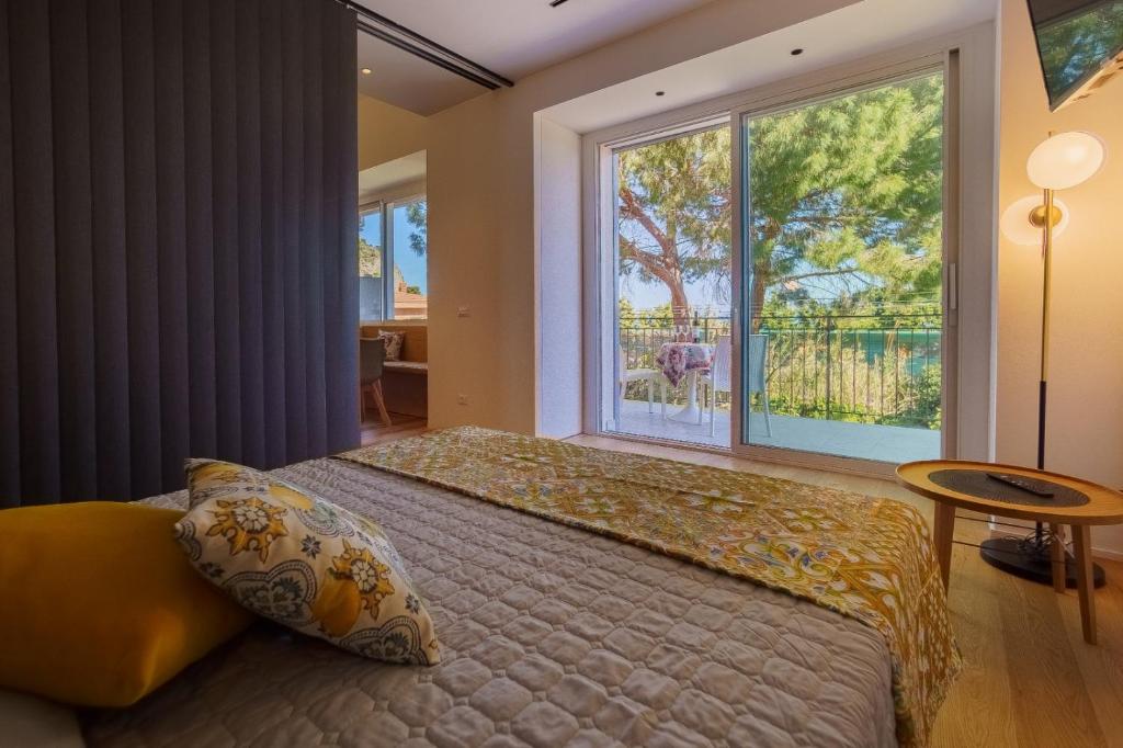 Posteľ alebo postele v izbe v ubytovaní Domus Aurea Luxury Apartment Cefalù