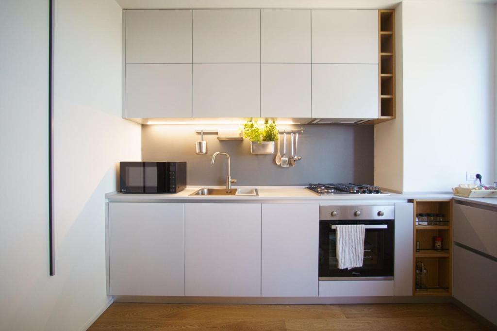 Kuchyňa alebo kuchynka v ubytovaní Domus Aurea Luxury Apartment Cefalù