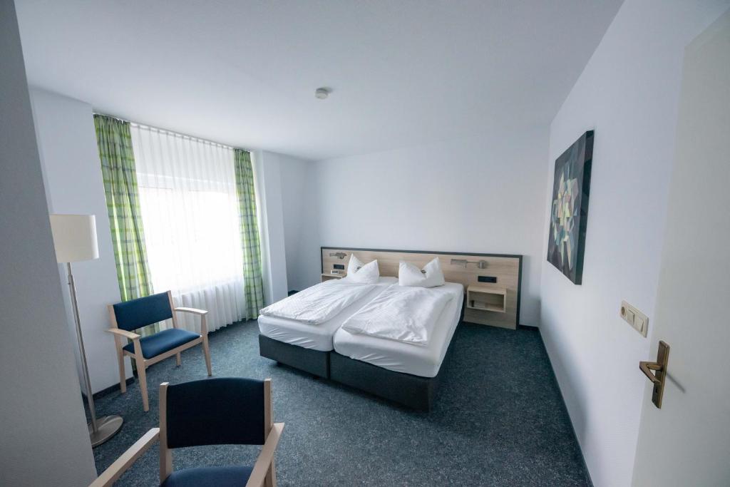 Postel nebo postele na pokoji v ubytování Hotel 7 Säulen GmbH