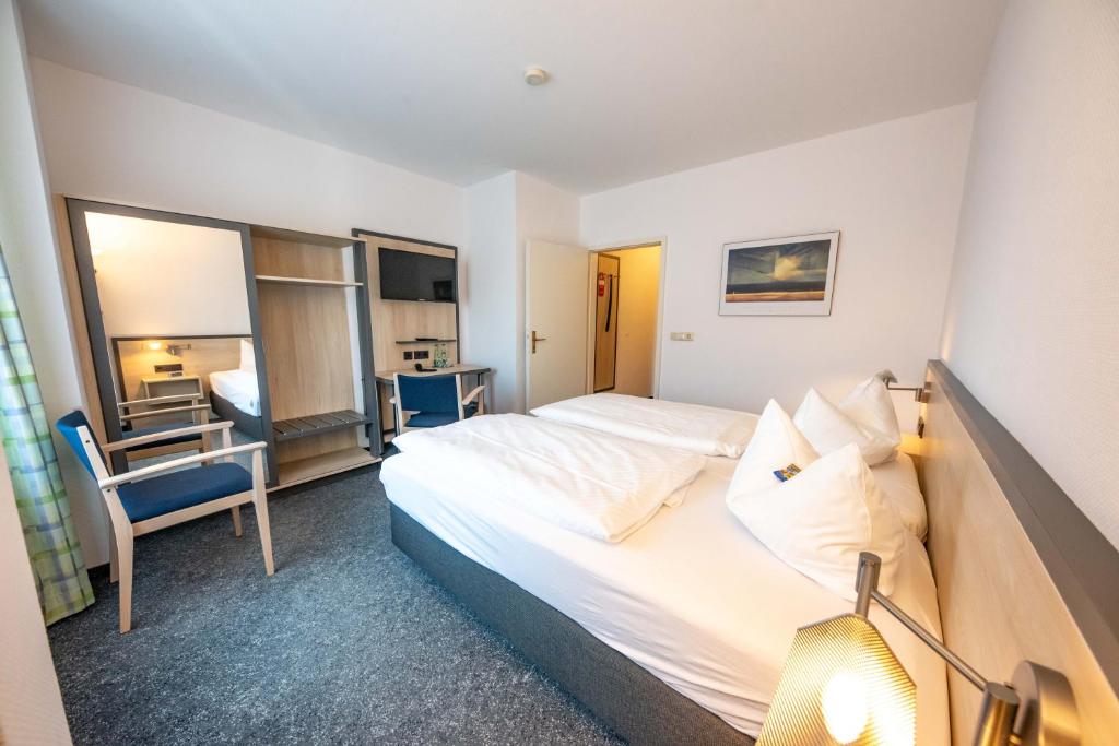 Postel nebo postele na pokoji v ubytování Hotel 7 Säulen GmbH