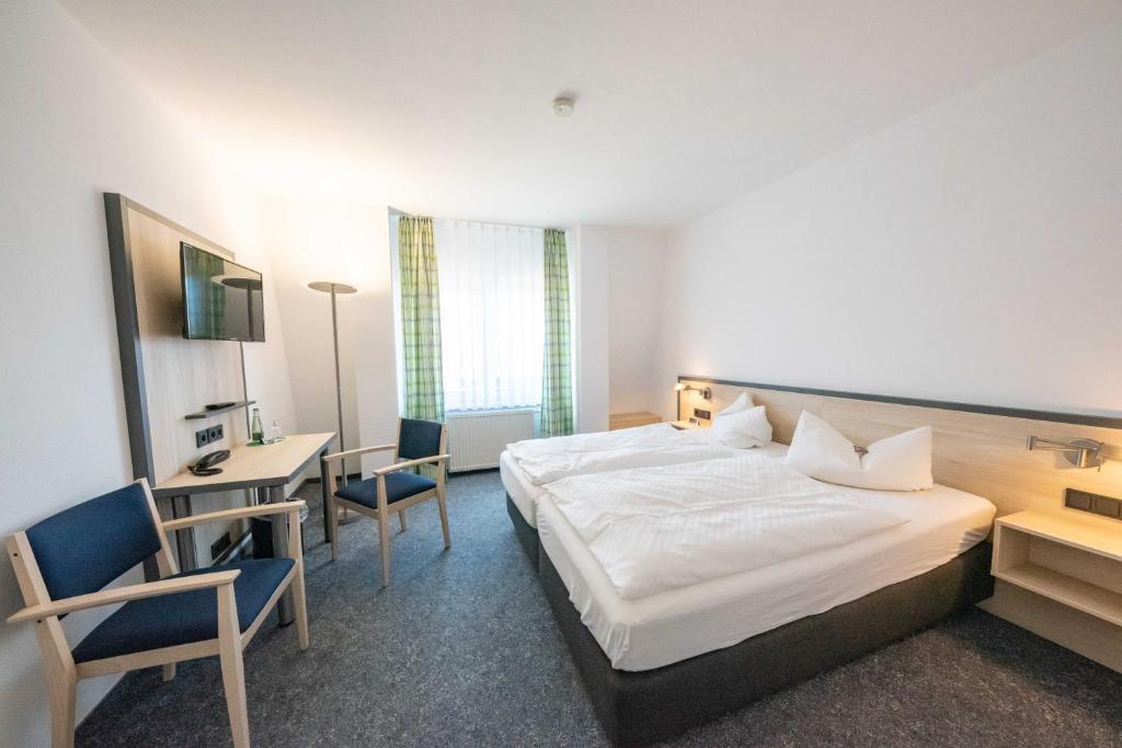 Postel nebo postele na pokoji v ubytování Hotel 7 Säulen GmbH