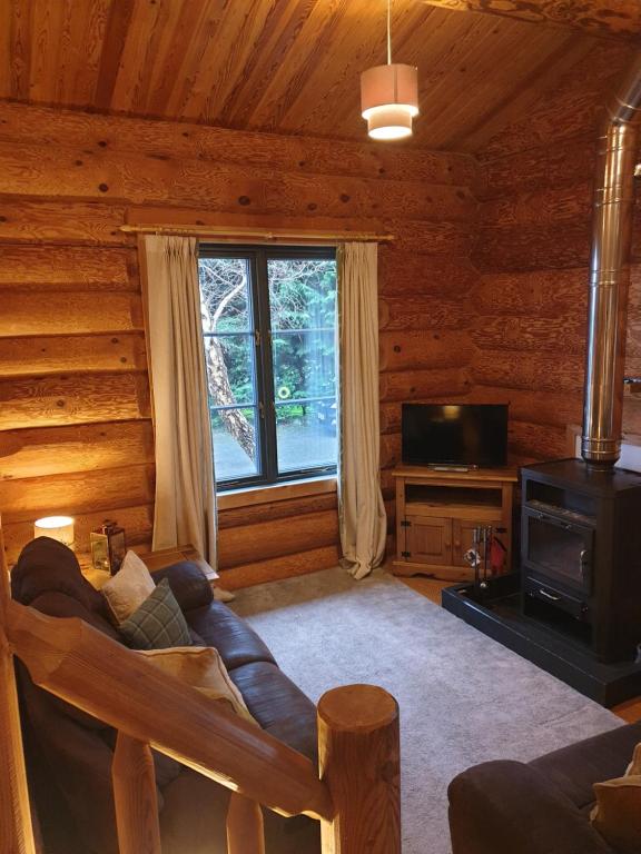 Posezení v ubytování Newland Valley Log Cabins
