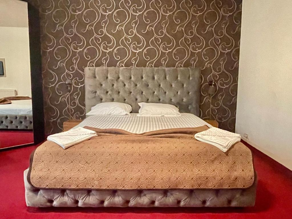 Postel nebo postele na pokoji v ubytování Hotel Mon Caprice