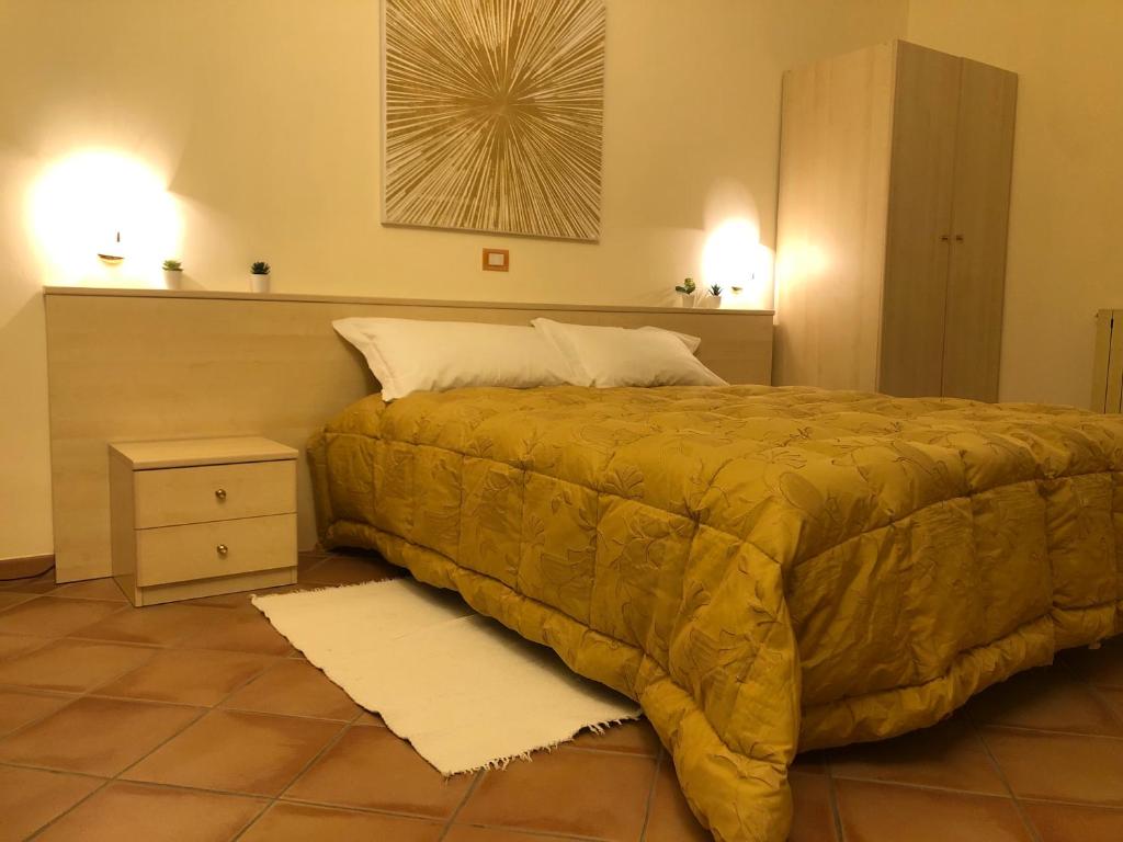 Łóżko lub łóżka w pokoju w obiekcie Hotel Di Rocco