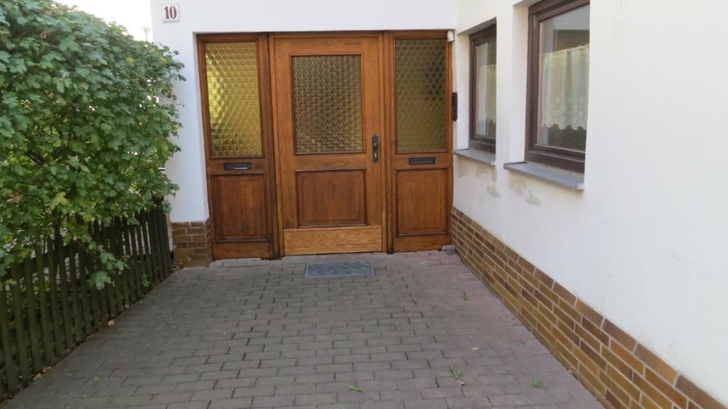 a wooden door on the side of a house at Alsfelder Apartment I in Alsfeld