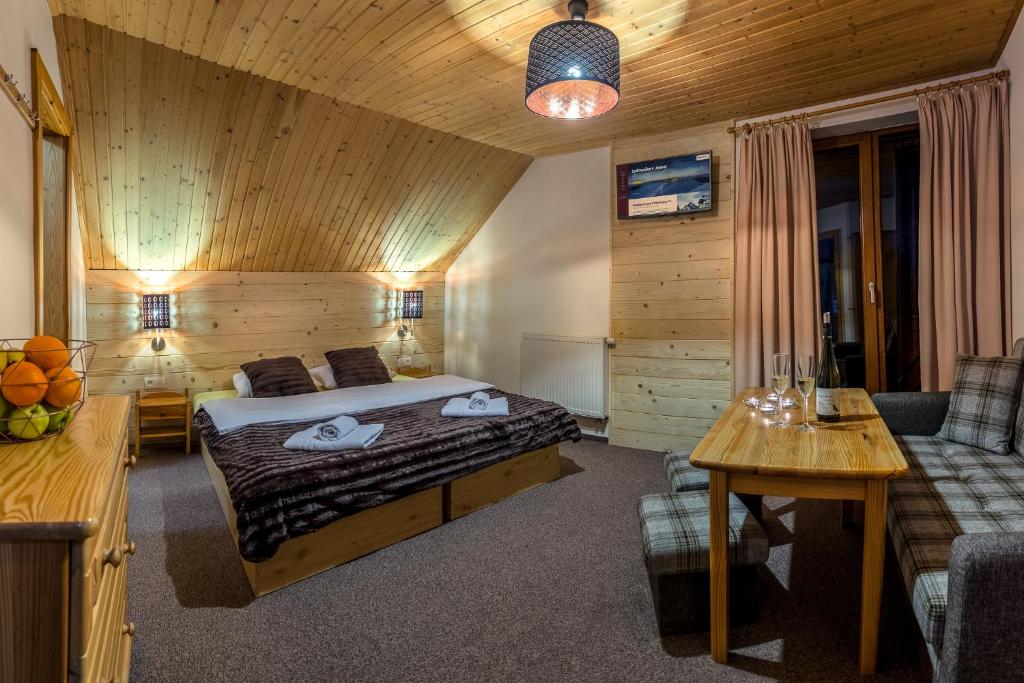 Postel nebo postele na pokoji v ubytování Apartmány a Štúdia Villa Flora