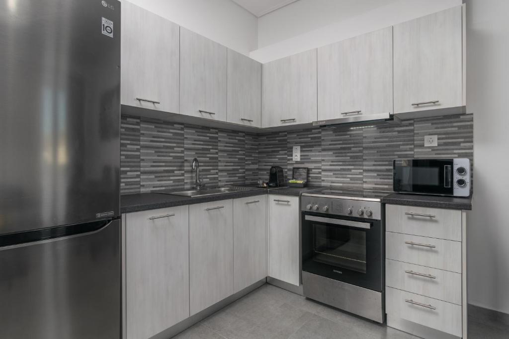 A kitchen or kitchenette at Emanouela's apartment in the center of Adamas