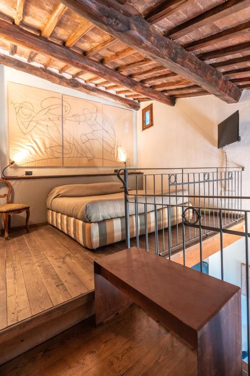 Postel nebo postele na pokoji v ubytování Hotel Della Fortezza