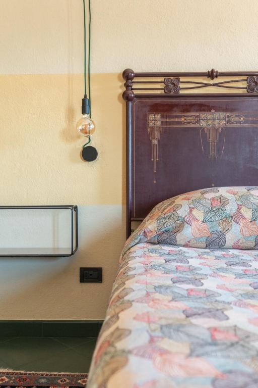 Postel nebo postele na pokoji v ubytování Hotel Della Fortezza