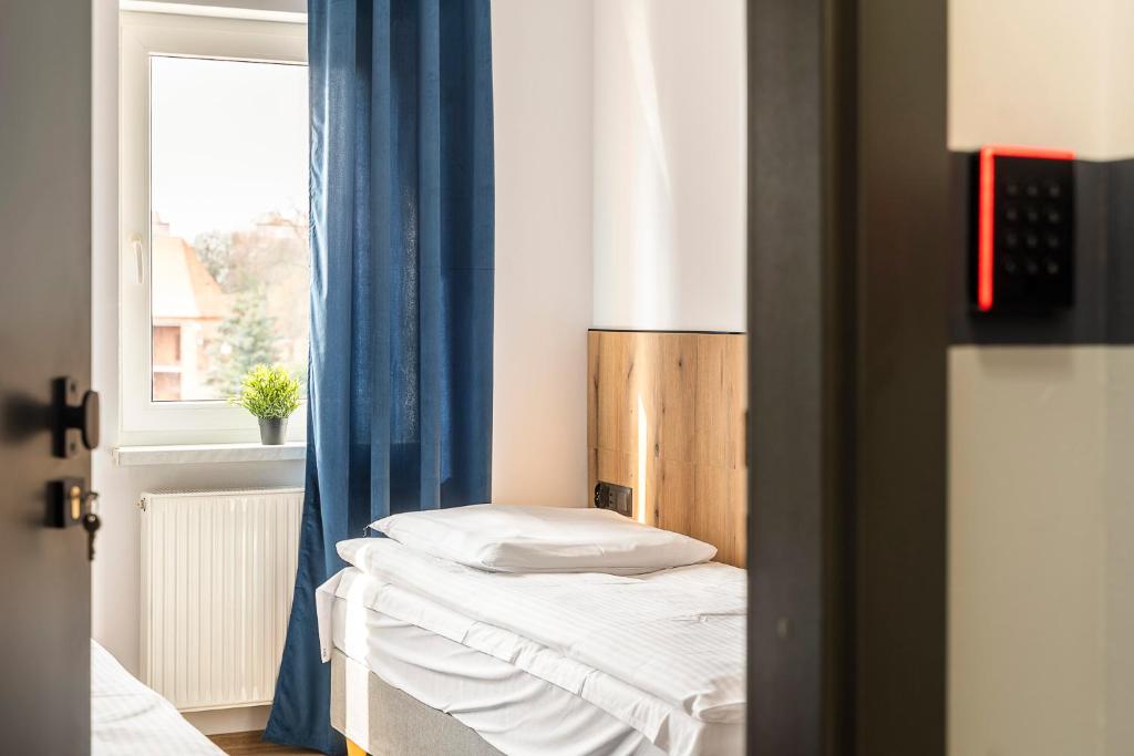 Postel nebo postele na pokoji v ubytování Gems Hostel