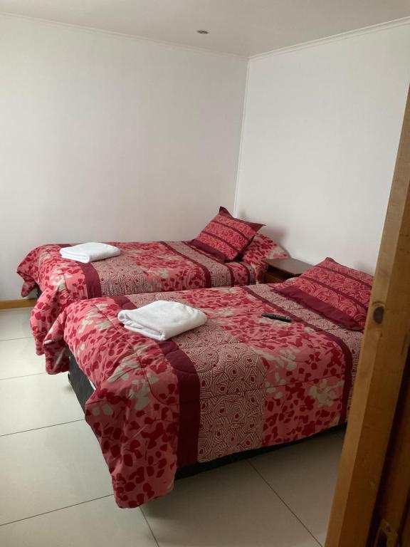 Letto o letti in una camera di Hostal Balmaceda