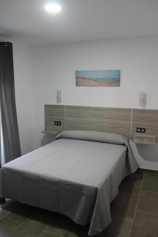 Posteľ alebo postele v izbe v ubytovaní Hostal Maria Jose