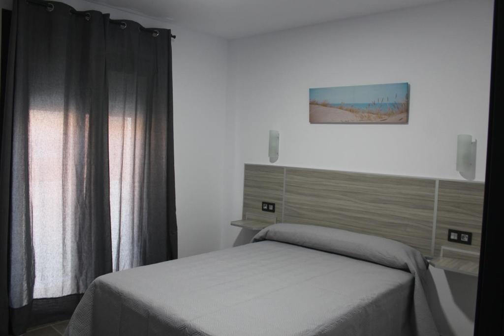 Posteľ alebo postele v izbe v ubytovaní Hostal Maria Jose