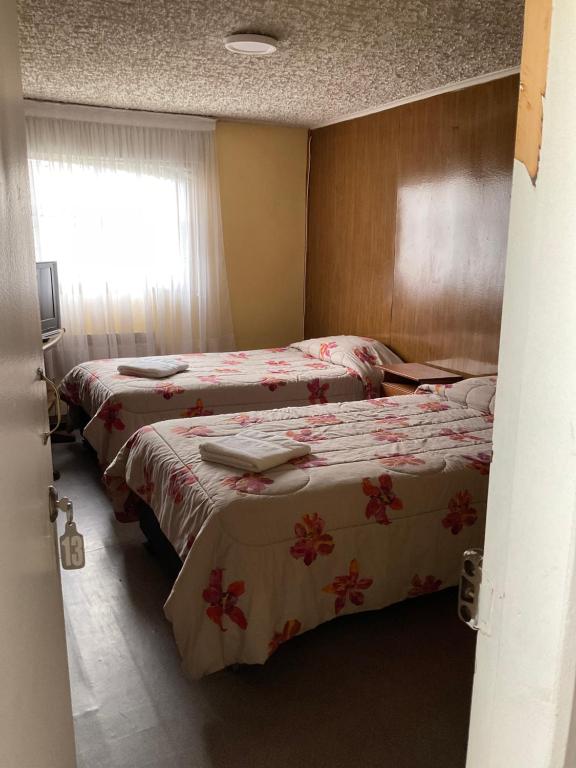 Letto o letti in una camera di Hostal Balmaceda