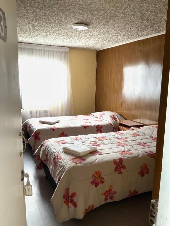 Letto o letti in una camera di Hostal Balmaceda