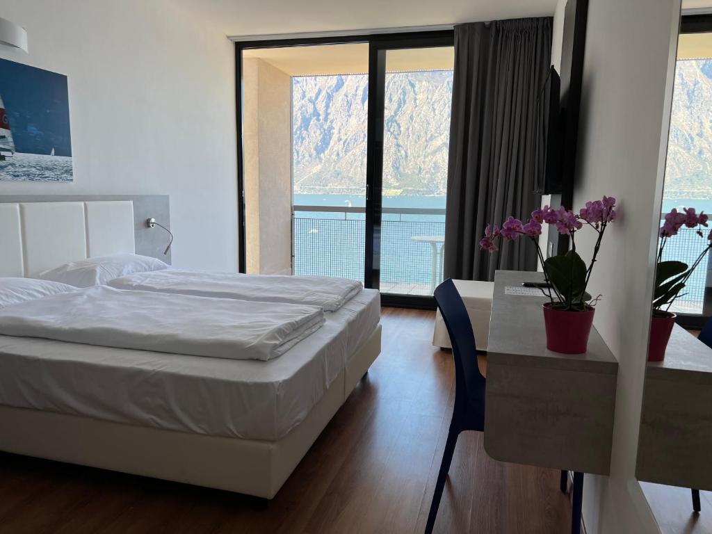 Postel nebo postele na pokoji v ubytování Wind Hotel