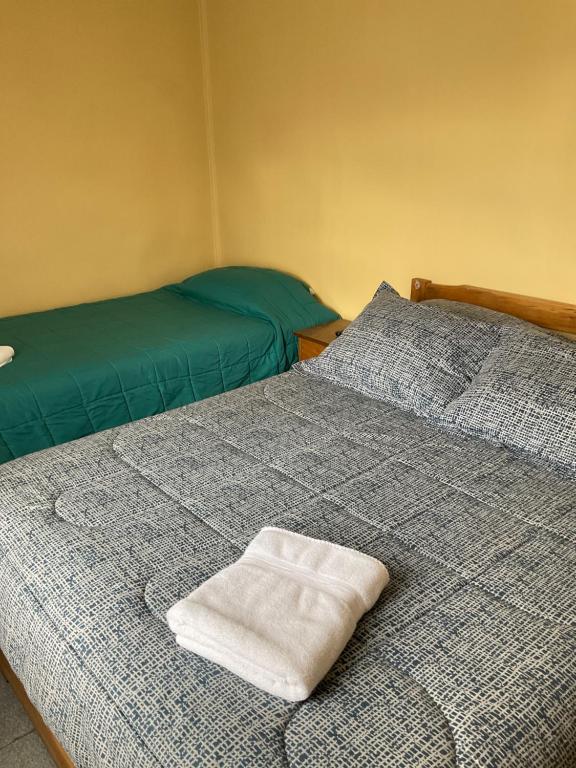 Letto o letti in una camera di Hostal Balmaceda