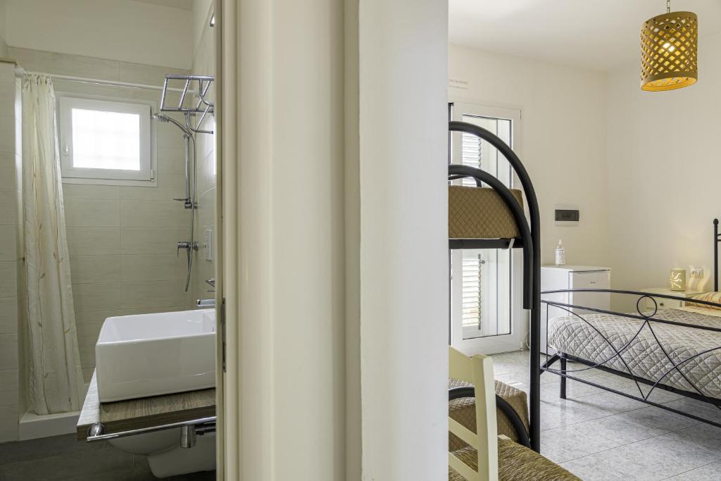 Łóżko lub łóżka w pokoju w obiekcie SalentOspita Guest Rooms