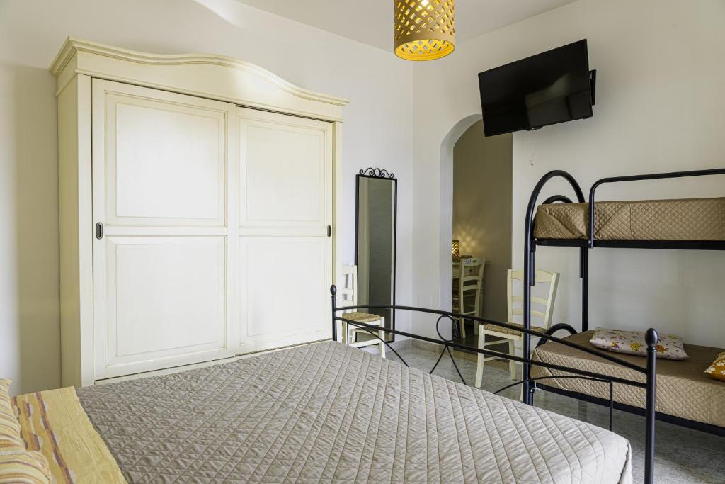 Łóżko lub łóżka w pokoju w obiekcie SalentOspita Guest Rooms